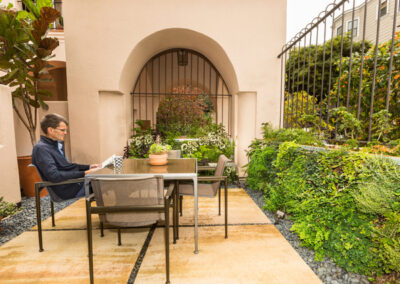 Green walls provide privacy and frame the setting for an urban oasis.